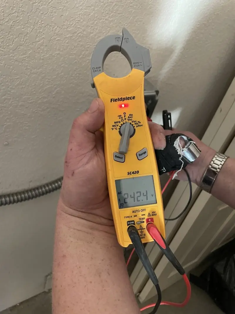 Voltage testing with clamp meter during Generator Installation in Harwood Heights